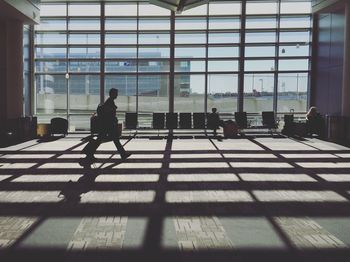 Silhouette people waiting at airport