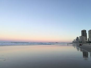 Scenic view of sea against clear sky during sunset