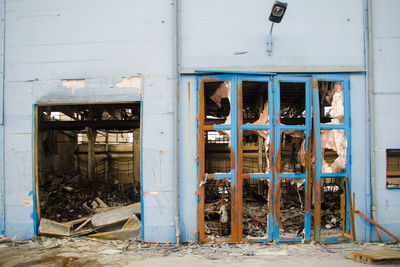 Shattered entrance of abandoned building