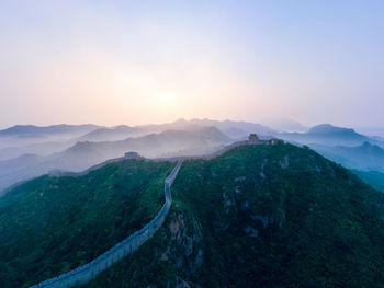 Scenic view of mountains against sky during sunset