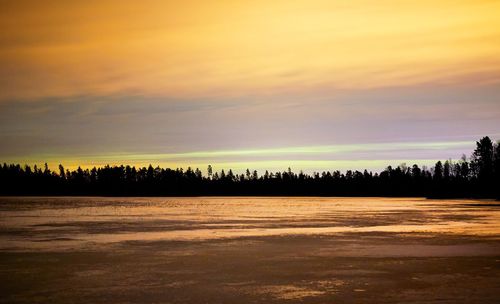 Scenic view of silhouette landscape against sky during sunset