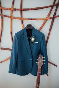 Midsection of man playing guitar