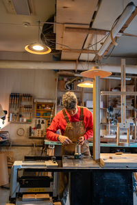 Rear view of man working at home