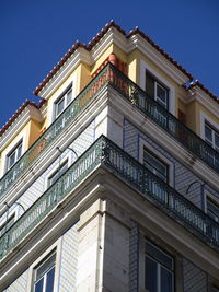 Low angle view of building against blue sky