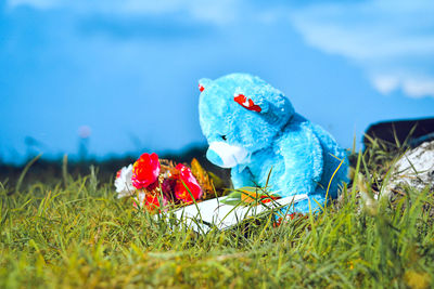 Close-up of stuffed toy on grassy field