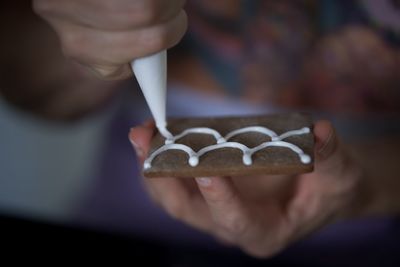 Close-up of hand holding ice cream