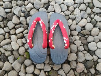 High angle view of flip-flops on stones