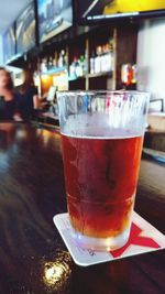 Close-up of beer in glass on table