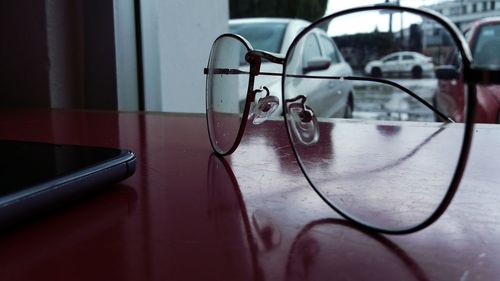 Close-up of eyeglasses on table