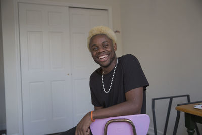 A young man sitting down