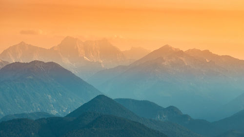 Scenic view of mountains against sky during sunset