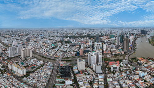 High angle view of city buildings against sky