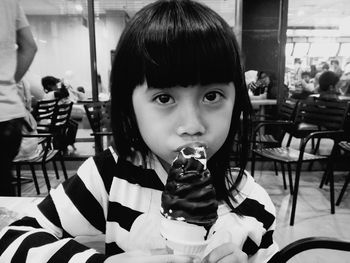 Portrait of girl eating ice cream