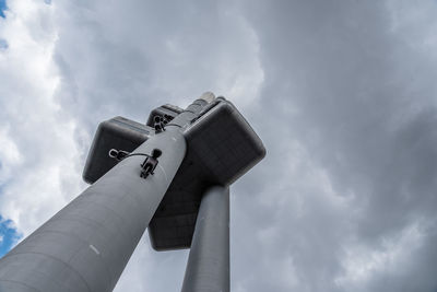 Low angle view of column against cloudy sky