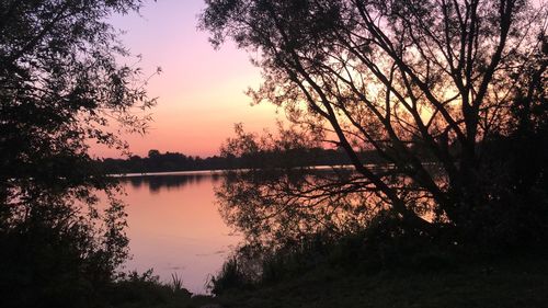 Scenic view of lake against sky during sunset