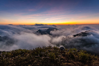 Aerial view of landscape against cloudy sky