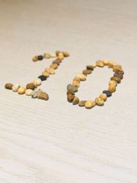 High angle view of number 10 made with stones on table