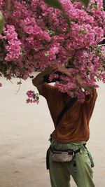 Woman working on pink flowers