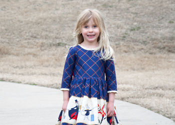 Portrait of smiling girl standing outdoors