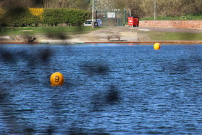 Yellow toy floating on swimming pool