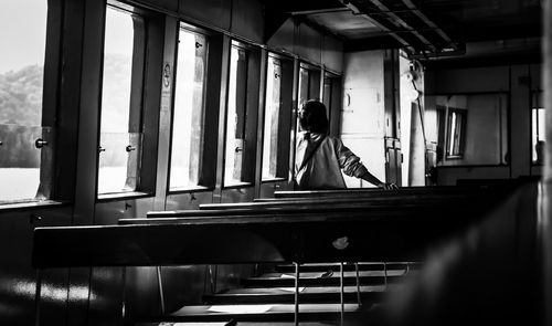 Side view of man sitting in bus