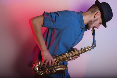 Close-up of man playing guitar