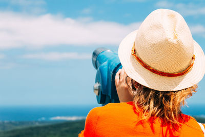 Rear view of woman looking at sea