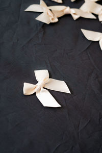 White silk ribbons isolated on the black background.