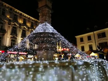 Illuminated christmas tree at night