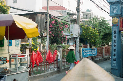 Clothes hanging on street in city