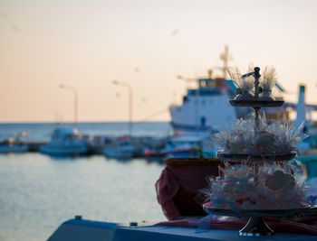 Close-up of ship moored at harbor against clear sky