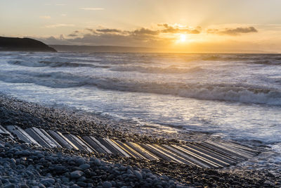 Scenic view of sea against sky during sunset