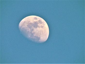 Close-up of moon against blue sky