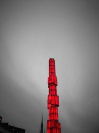 Low angle view of red light against clear sky