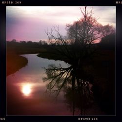 Scenic view of lake at sunset