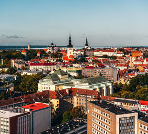 High angle view of buildings in town against sky