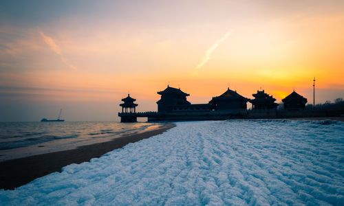 Scenic view of sea against sky during sunset