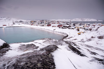 Panoramic view of buildings against sky during winter