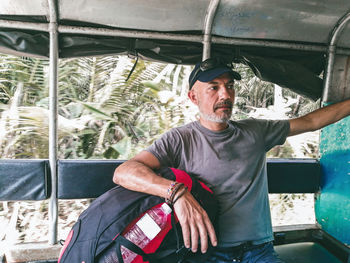 Portrait of man sitting in car