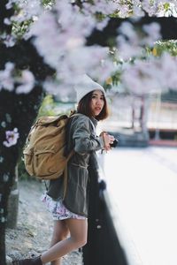 Woman standing in city during winter