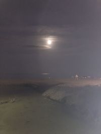 Scenic view of sea against sky at night