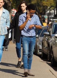 Friends standing on street in city