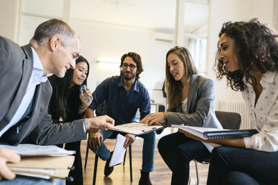 Business people having a team meeting in office