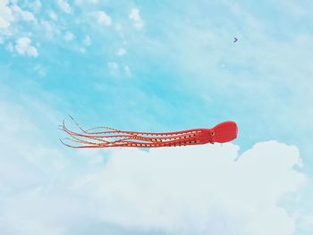 Low angle view of kite flying in sky