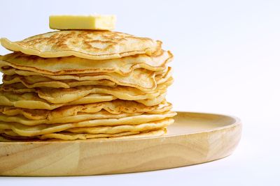 Stack of bread against white background