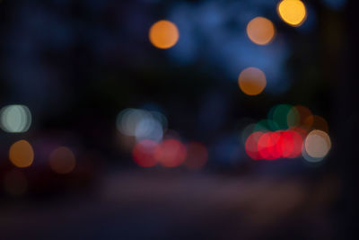 Defocused image of illuminated lights at night