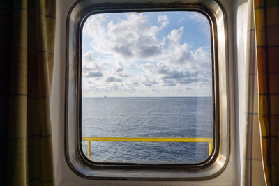 Scenic view of sea seen through window