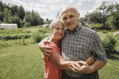 Portrait of senior couple embracing each other in the garden