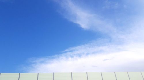 Low angle view of sky seen through fence