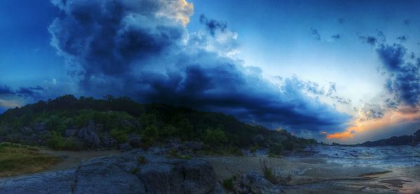 Scenic view of landscape against cloudy sky